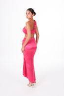 Back view of ANAYA Set - Fuchsia Flame Satin highlighting the sleek satin finish and fitted silhouette of the skirt and top.